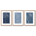 Minimal Sketch Flowers on Blue Shades Set of 3 Framed Art Prints with Light Oak Frames