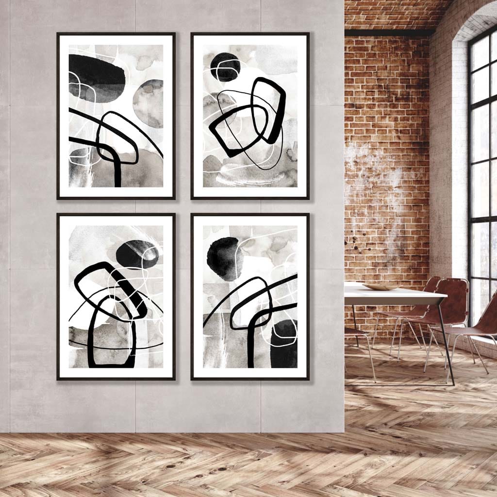 A Set of 4 Black and White Abstract Wall Art in Black Wooden Frames featuring watercolour shapes