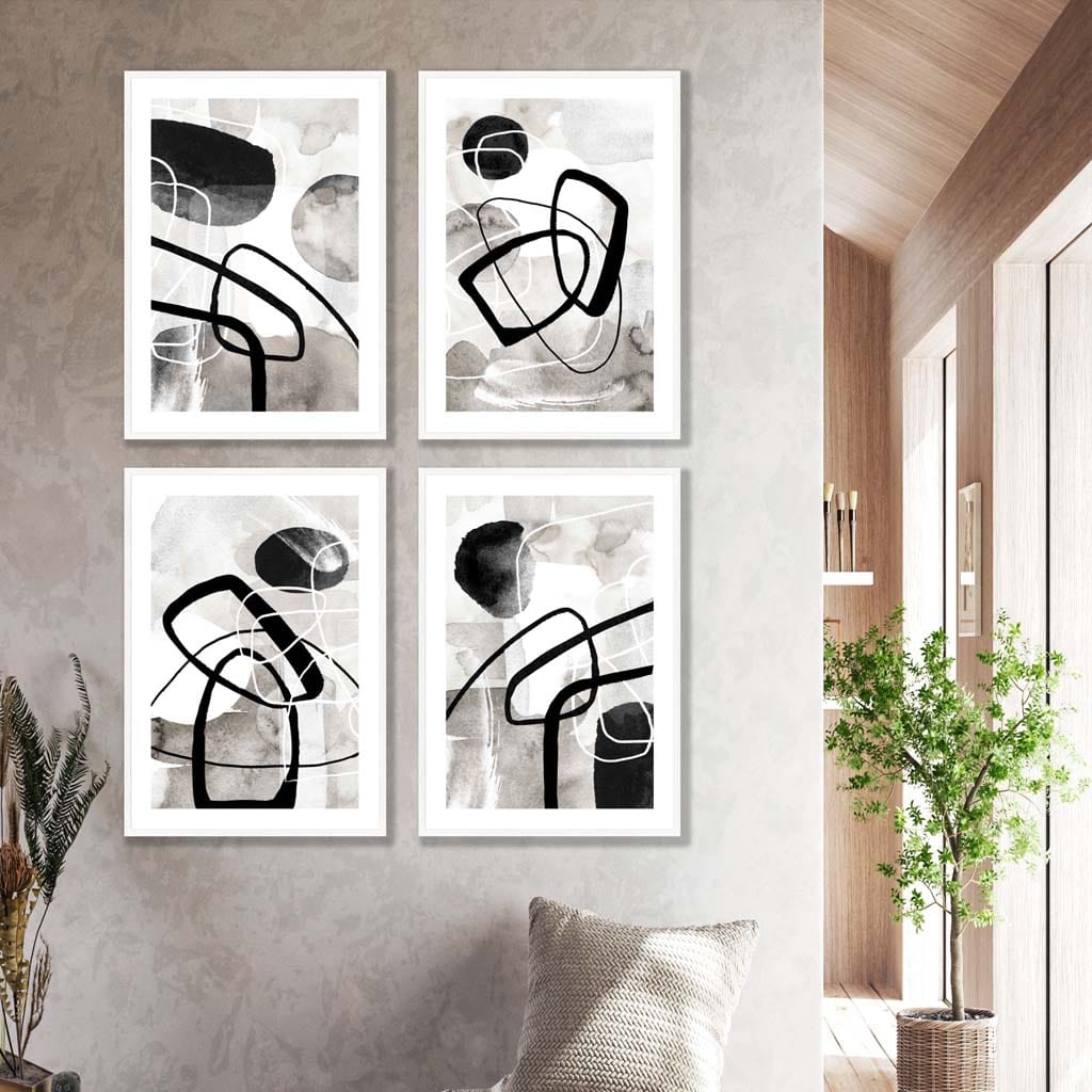 A Set of 4 Black and White Abstract Wall Art in White Frames featuring watercolour shapes