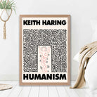 Keith Haring Humanism in Pink print in Light Oak Frame