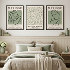 A styled bedroom interior with three framed Matisse-style wall art prints above a bed. The prints feature muted sage green and cream abstract line-art designs with text including 'MATISSE', 'MUSEE D'ORSAY', and 'WILLIAM MORRIS'.
