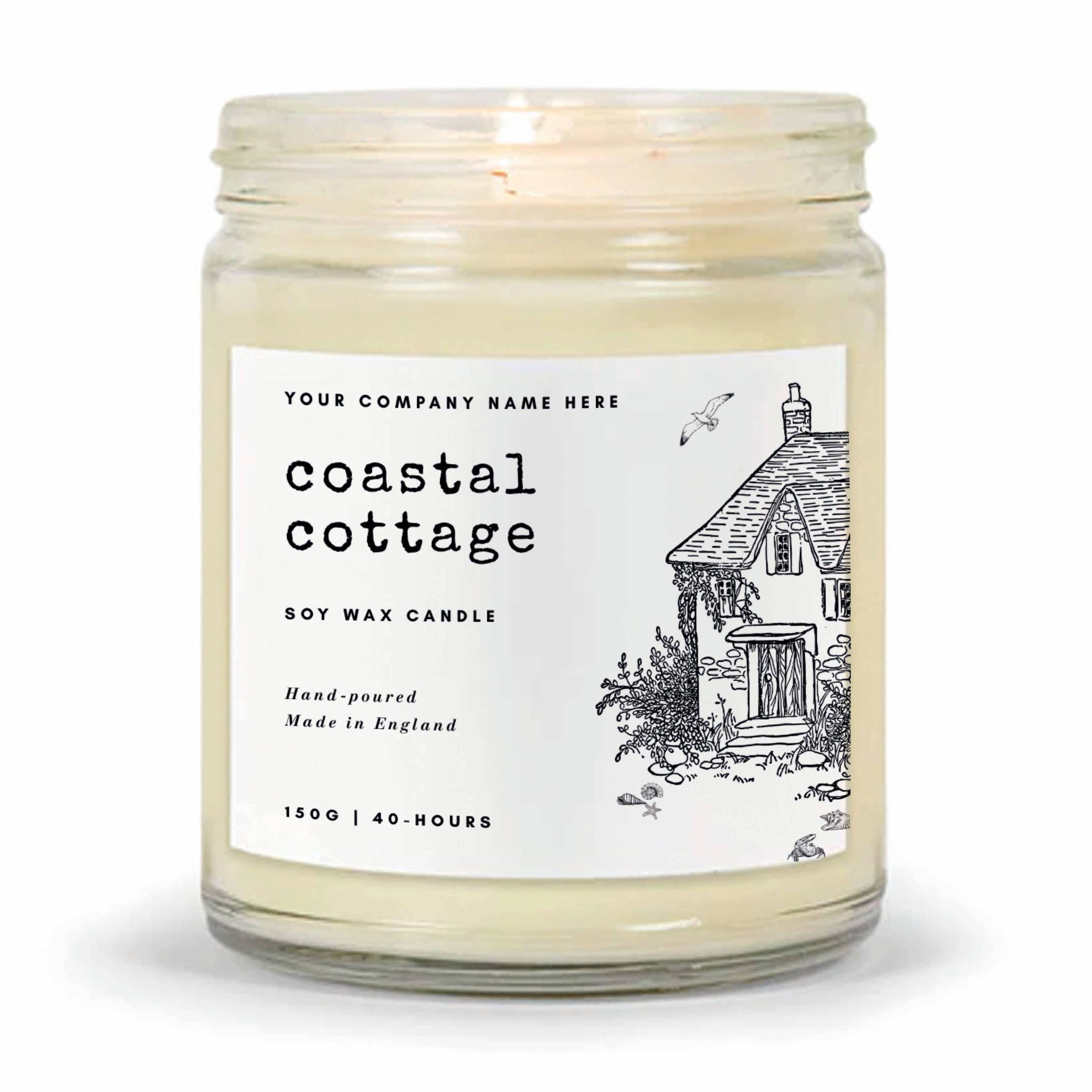 Soy wax candle with a label featuring 'coastal cottage' design on a white background