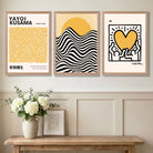 Panelled Hallway Showcasing a Set of 3 Yayoi Kusama, Keith Haring Yellow Art Prints in Oak Frames | Artze UK