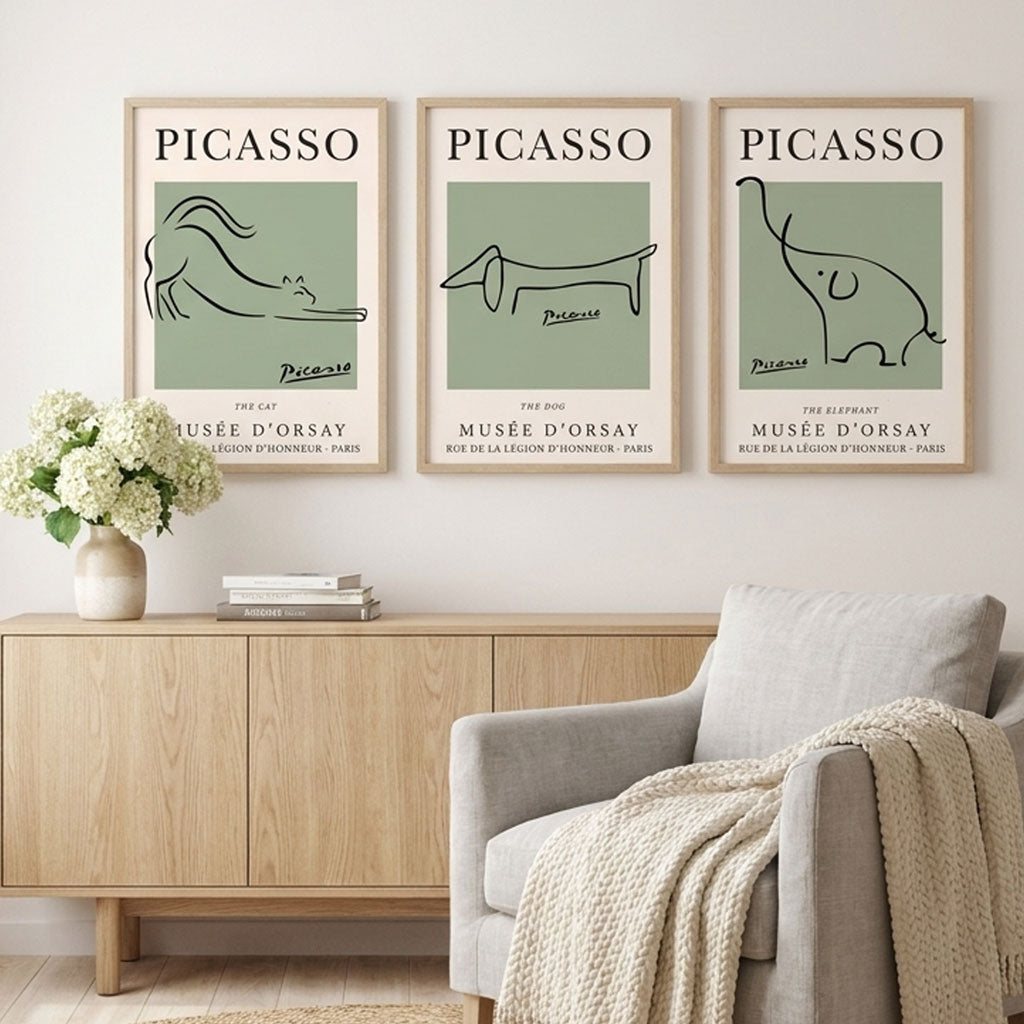 Picasso minimal animal art prints in Sage Green with Light Oak Frames featured in a minimalist scandinavian style living room.