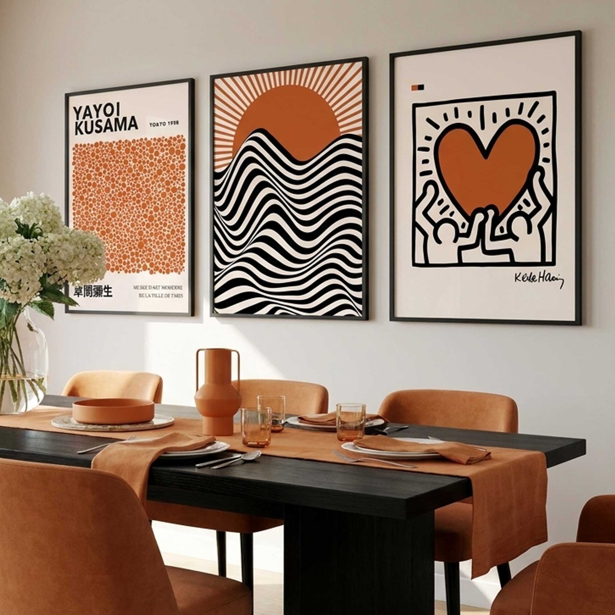 et of 3 Orange and Black Yayoi Kusama,Bauhaus,Keith Haring Prints in Orange showcased in a modern dining room