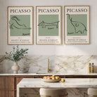 set of 3 picasso animal prints in sage green with oak frames in a stylish modern kitchen