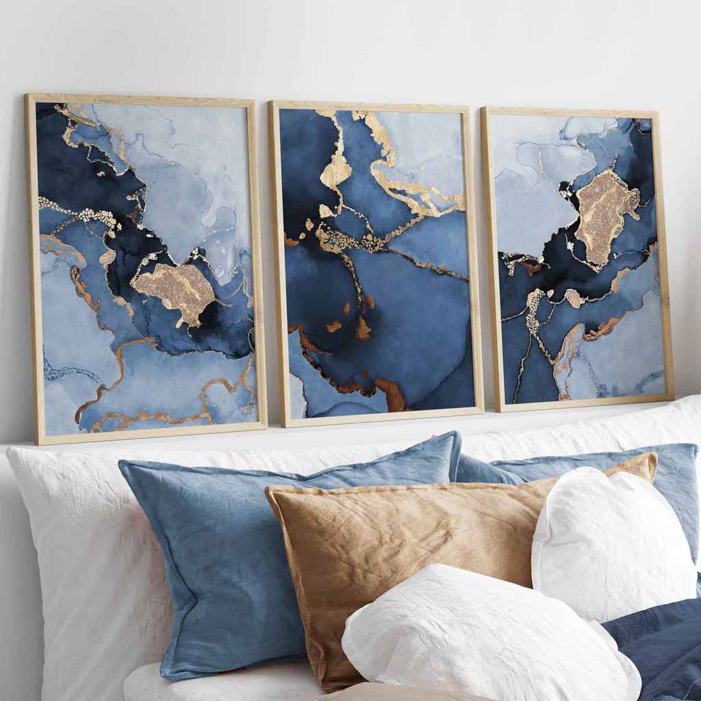These Navy Blue and Gold Prints of Marble paintings make a striking impression in a bedroom