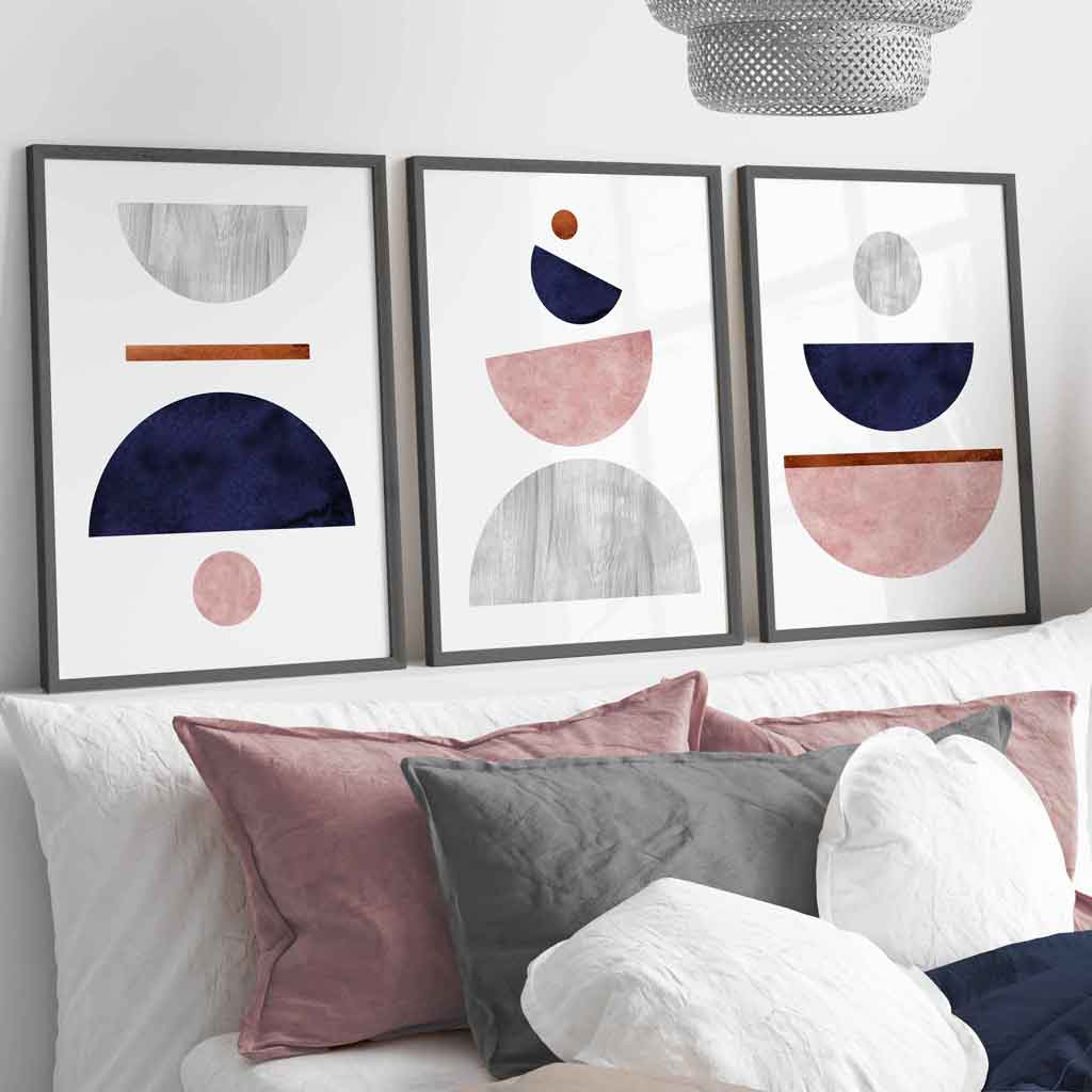 Blue, Pink and Grey geometric prints in dark grey frames perfect for the bedroom